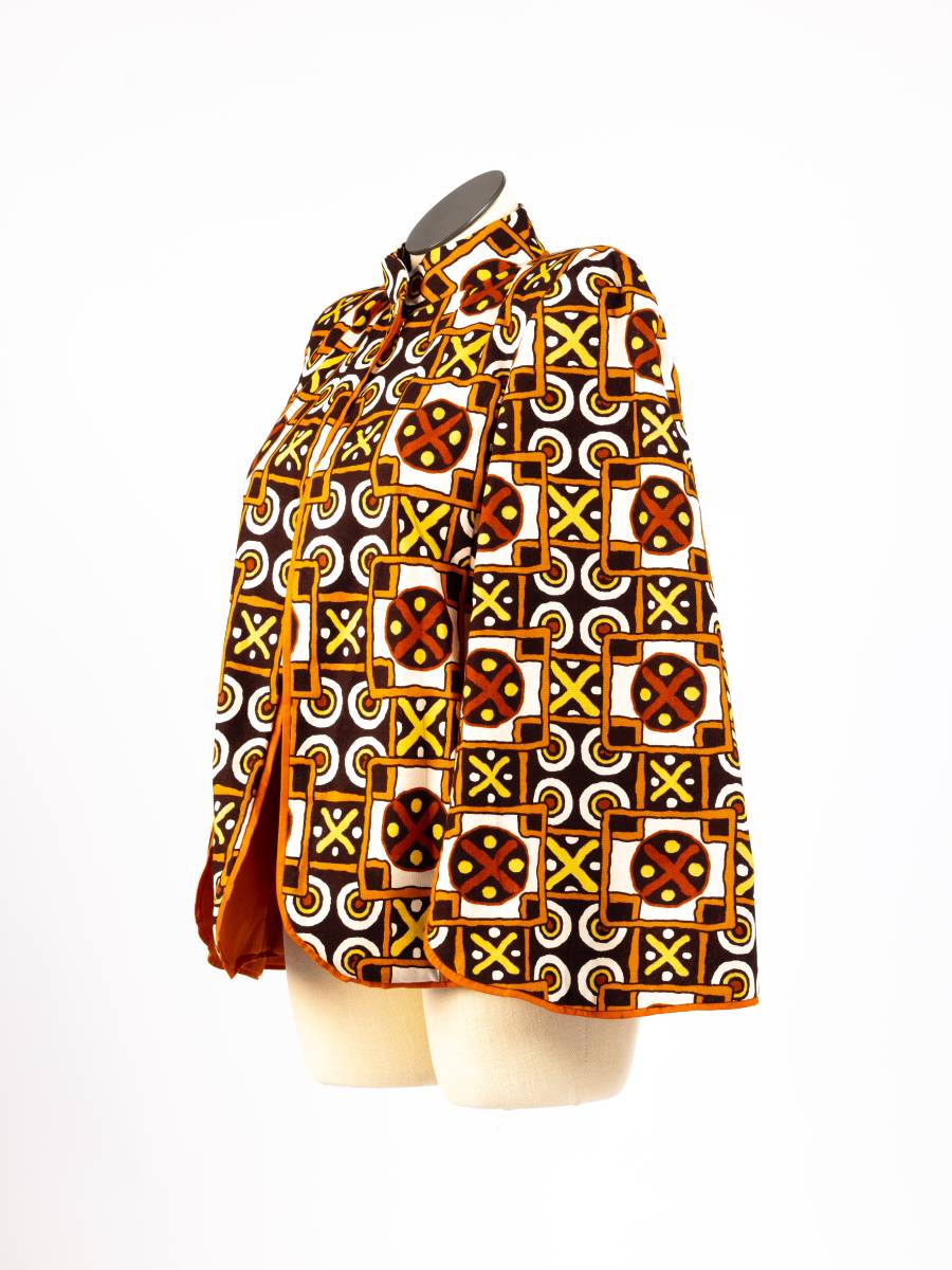 Orange patterned open cape blazer, side view