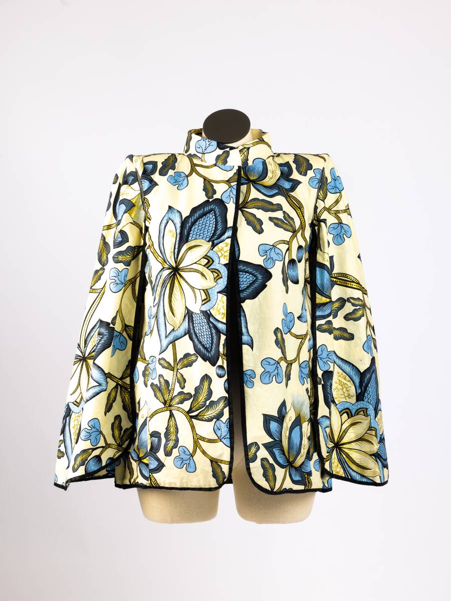 Cream floral patterned open cape blazer, front view