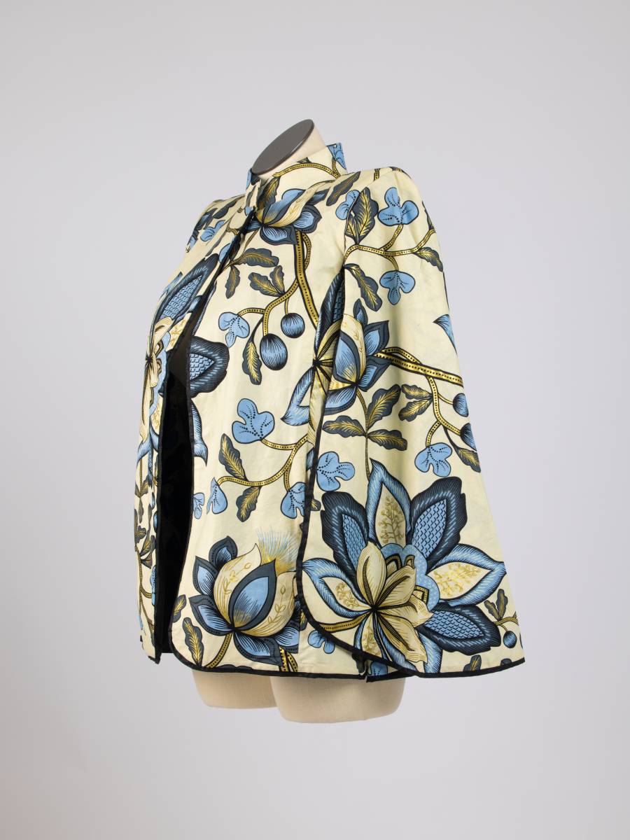 Cream floral patterned open cape blazer, side view