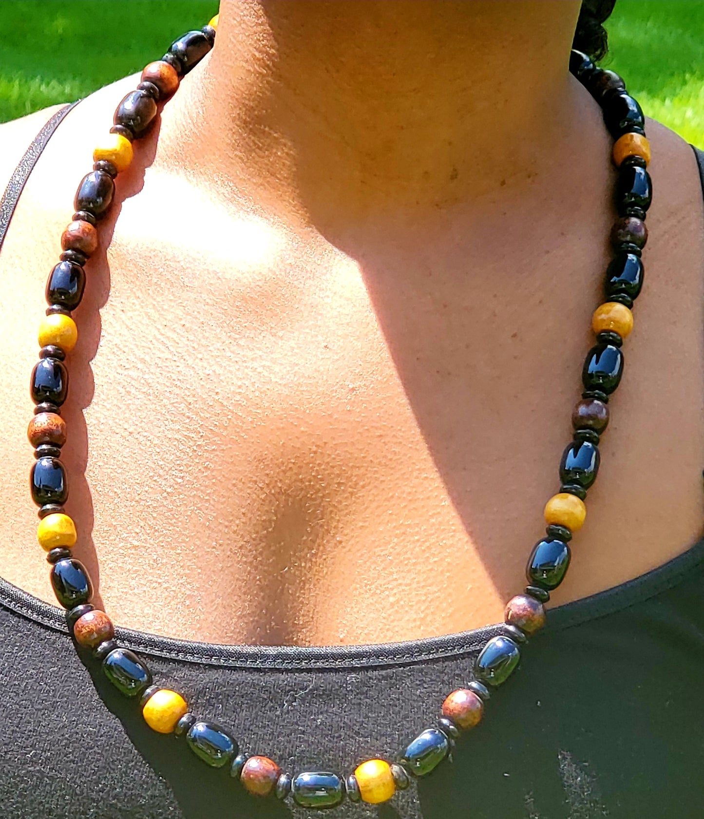 Traditional wooden beaded necklace, with lighter and darker beads interspersed
