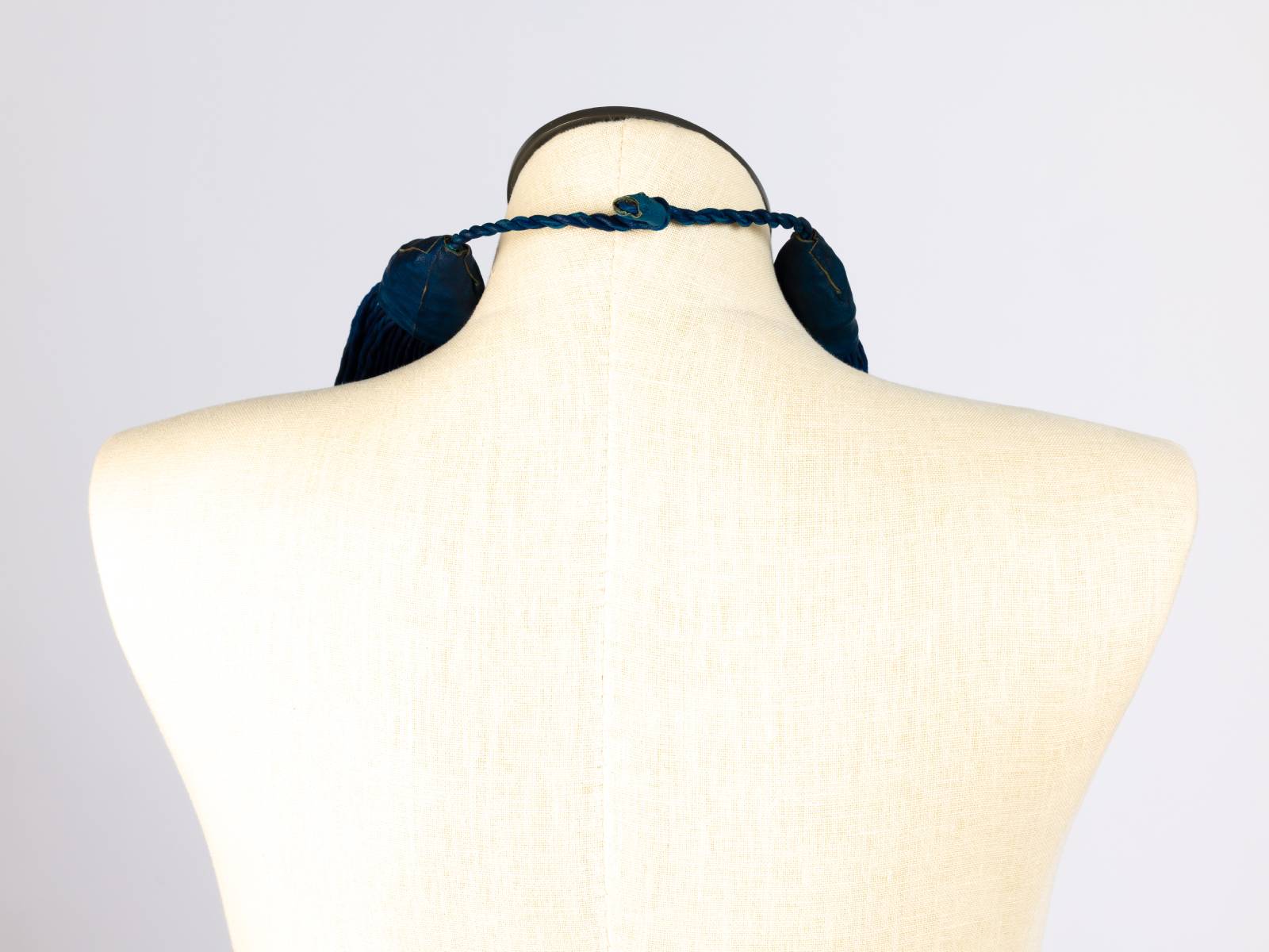 Blue leather collar, back view